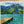 Swimmers by a Jetty on a Mountain Lake Wall Art