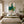 Emerald Dancer Figure Wall Art styled above an elegant bedroom | OILDECO