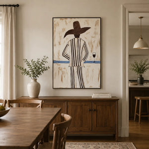 Sun Hat Figure Wall Art displayed above a sofa in a neutral interior | Oildeco