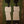 Two Cream-Clad Figures on Olive Green Wall Art artwork view | OILDECO
