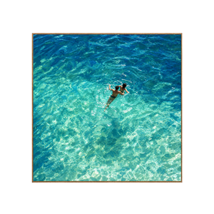 Two Swimmers in Sunlit Turquoise Water Wall Art | OILDECO