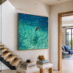 Two Swimmers in Sunlit Turquoise Water Wall Art styled interior scene 1 | OILDECO
