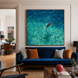 Two Swimmers in Sunlit Turquoise Water Wall Art styled interior scene 3 | OILDECO
