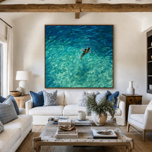 Two Swimmers in Sunlit Turquoise Water Wall Art styled interior scene 4 | OILDECO