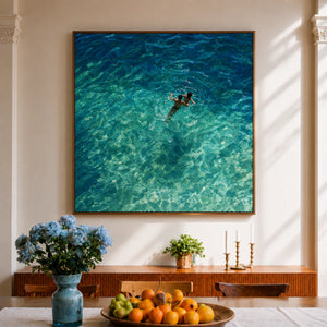 Two Swimmers in Sunlit Turquoise Water Wall Art styled interior scene 5 | OILDECO
