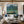 Mountain Lake with Swimmers and a Wooden Dock Wall Art styled interior scene 2 | OILDECO