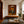 Seated Figure in Ochre with a Black Cat Wall Art styled interior scene 3 | OILDECO