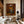 Seated Figure in Ochre with a Black Cat Wall Art styled interior scene 4 | OILDECO