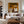 Two Hat Figures Under Palms on Ochre Wall Art styled interior scene 3 | OILDECO