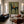 Red Rider on a Navy Horse with Sage Ground Wall Art styled interior scene 4 | OILDECO