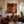 Striped Figure Beneath a Palm on Warm Brown Wall Art styled interior scene 2 | OILDECO
