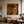 Striped Figure Beneath a Palm on Warm Brown Wall Art styled interior scene 5 | OILDECO