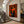 Orange Book Reader with a Cup and Checked Trousers Wall Art styled interior scene 2 | OILDECO