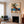 Blue-Hatted Surfer Carrying a Brown Board Wall Art styled interior scene 1 | OILDECO
