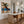 Blue-Hatted Surfer Carrying a Brown Board Wall Art styled interior scene 2 | OILDECO