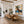 Blue-Hatted Surfer Carrying a Brown Board Wall Art styled interior scene 3 | OILDECO