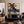 Blue-Hatted Surfer Carrying a Brown Board Wall Art styled interior scene 4 | OILDECO