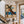 Blue-Hatted Surfer Carrying a Brown Board Wall Art styled interior scene 5 | OILDECO