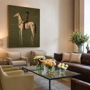 Dark-Hatted Rider on a Cream Dappled Horse Wall Art styled interior scene 1 | OILDECO