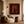 Pink-Hatted Trio in Mustard Tops and Red Trousers Wall Art styled interior scene 1 | OILDECO