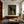 Cream-Clad Figure with a Black Horse on Olive Wall Art styled interior scene 5 | OILDECO