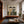 Seated Companions in Ochre and Green Stripes Wall Art styled interior scene 2 | OILDECO