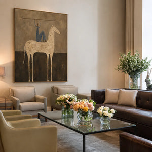 Blue Rider Balancing a Line Above a Cream Horse Wall Art styled interior scene 2 | OILDECO