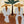 Striped Companions with Straw Hats Beneath Broad Leaves Wall Art artwork view | OILDECO