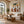 Striped Companions with Straw Hats Beneath Broad Leaves Wall Art styled interior scene 4 | OILDECO