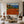 Terracotta Tennis Court above a Blue Bay Wall Art styled interior scene 2 | OILDECO