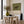 Red-Capped Rider on a Dark Horse in Olive Wall Art styled interior scene 3 | OILDECO