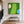 Tiny Golfers on a Lime Fairway beside Blue Water Wall Art styled interior scene 2 | OILDECO