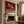 Green Striped Rider on a Burgundy Ground Wall Art styled interior scene 1 | OILDECO