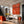 Sunlit Tennis Rally on an Orange Court Wall Art styled interior scene 3 | OILDECO