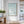 Aqua Swimmers Coastal Wall Art shown in a calm bedroom setting | Oildeco