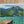 Swimmers by a Jetty on a Mountain Lake Wall Art